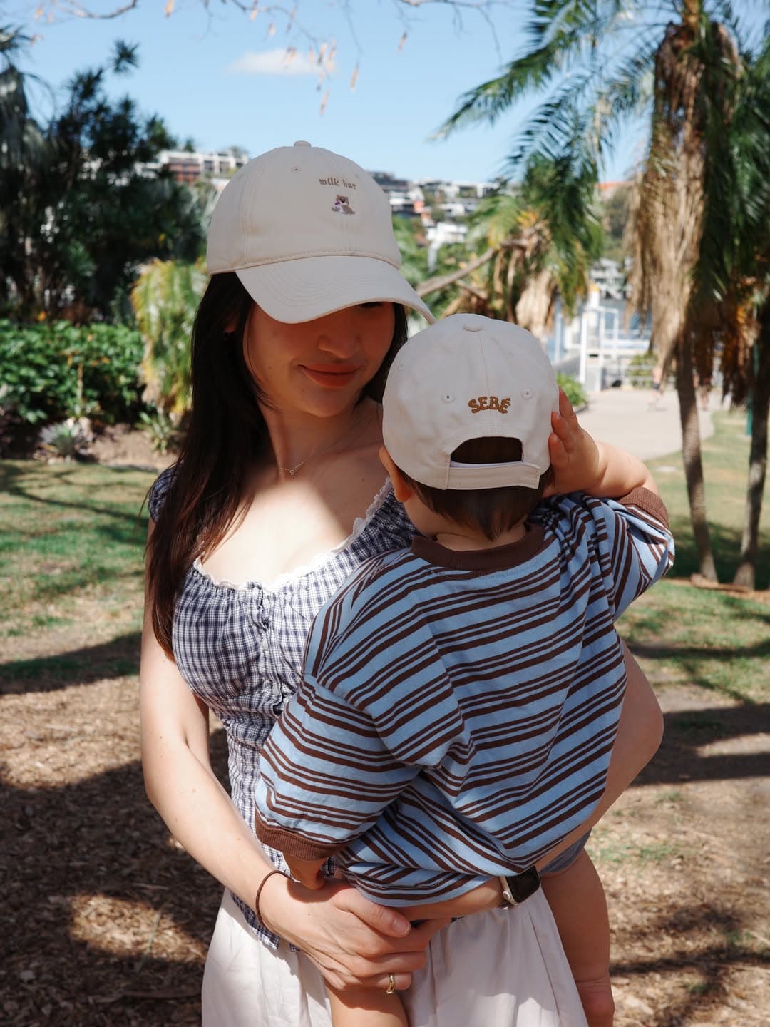 Parent and child wearing matching Sebé caps